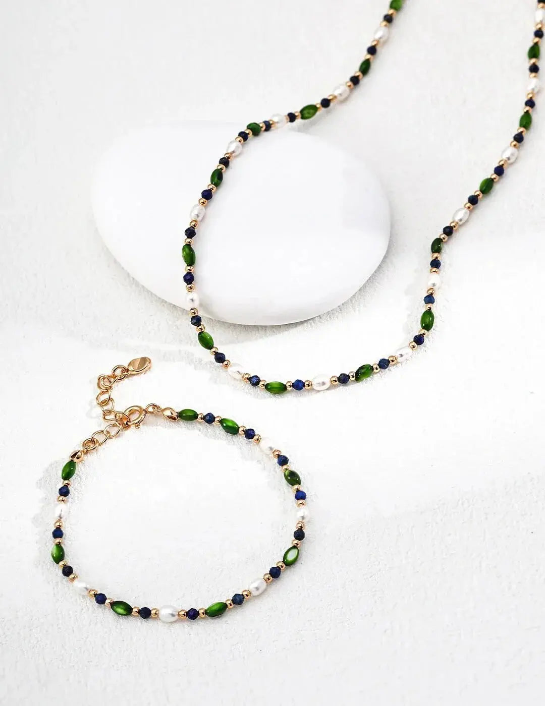 How Olive-Green Gemstones Balance Authority & Approachability in the Office Glim Wink